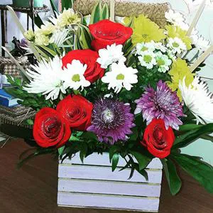 Beautiful and bright selection - Wooden box with flowers